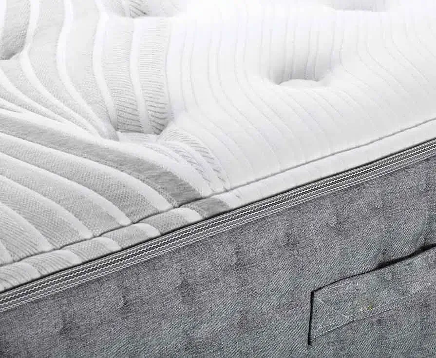 Close-up of textured white mattress surface